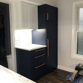Liva Kitchen Bath - a dark blue kitchen with a white countertop - Countertop Installation Near Me - Chantilly, Virginia Liva Kitchen Bath - a dark blue kitchen with a white countertop - Countertop Installation Near Me - Chantilly, Virginia
