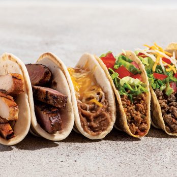 Taco Cabana - a row of taco shells - Mexican Near Me - Austin, Texas Taco Cabana - a row of taco shells - Mexican Near Me - Austin, Texas