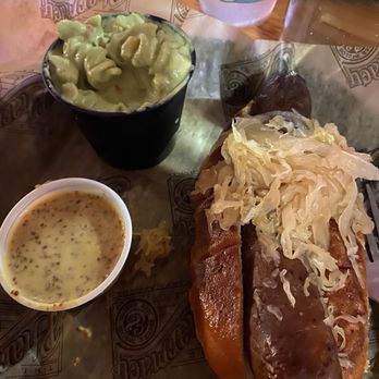 The Pharmacy Burger Parlor - Kielbasa with sauerkraut, beer mustard, and poblano pasta salad - Sports Bars Near Me - Nashville, Tennessee The Pharmacy Burger Parlor - Kielbasa with sauerkraut, beer mustard, and poblano pasta salad - Sports Bars Near Me - Nashville, Tennessee