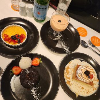 Fogo de Chão - Molten lava cake, creme Brulee, tres leche, and papaya cream - Steakhouses Near Me - Lone Tree, Colorado
