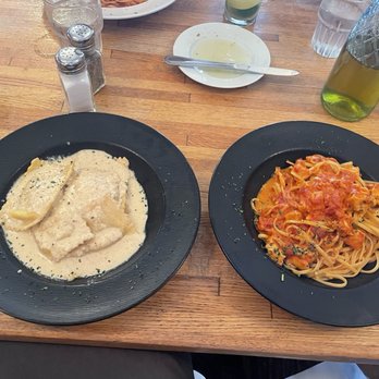 Oliverii North - Ravioli stuffed with a walnut & ricotta combo is on the left. Salmon & linguine in vodka sauce on the right. - Italian Near Me - Antioch, Illinois