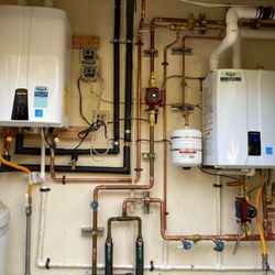 Precision Plumbing & Heating - Two Navien tankless water heaters in one home