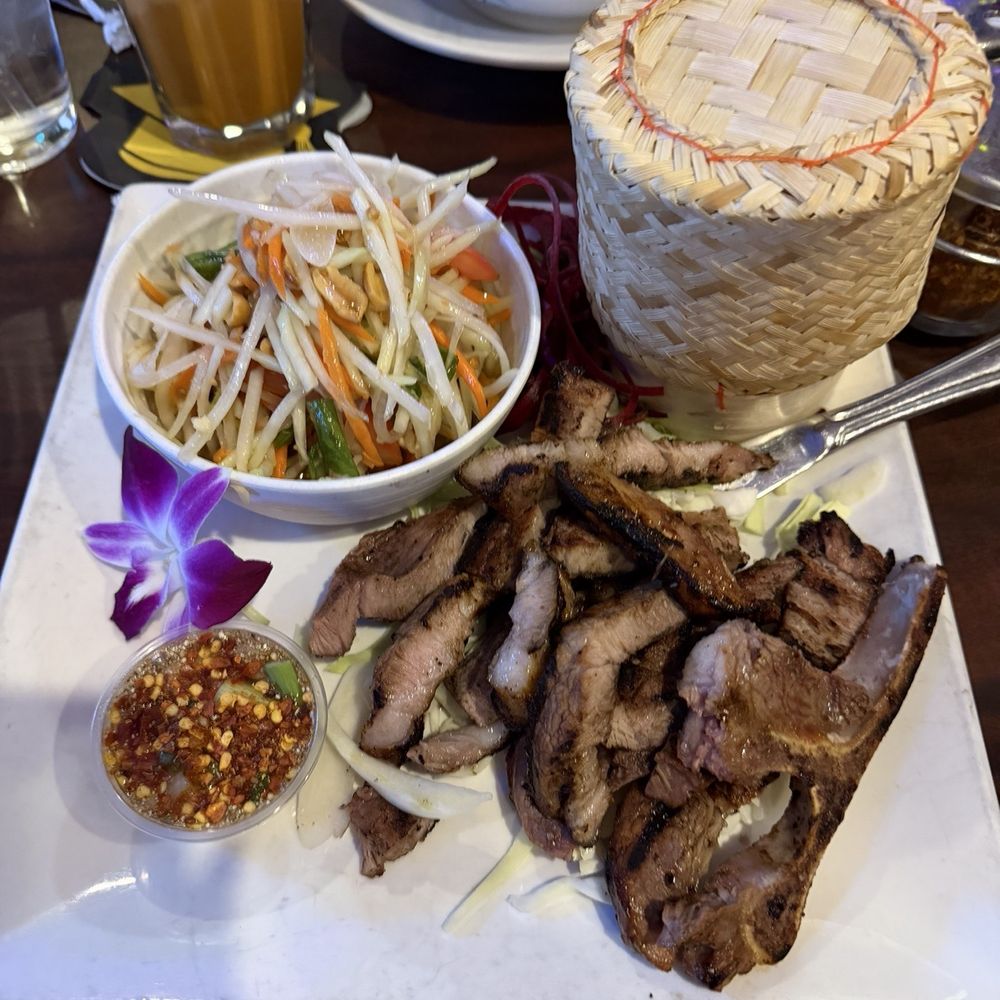 LucKi Thai Bistro - Grilled Pork Chop With Sticky Rice and Papaya Salad - Thai Near Me - Las Vegas, Nevada LucKi Thai Bistro - Grilled Pork Chop With Sticky Rice and Papaya Salad - Thai Near Me - Las Vegas, Nevada