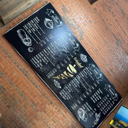 a menu on a brick wall