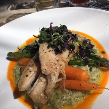 Latitudes - Sunset Key Cottages - Local fish over risotto with carrots and asparagus - Seafood Near Me - Key West, Florida Latitudes - Sunset Key Cottages - Local fish over risotto with carrots and asparagus - Seafood Near Me - Key West, Florida