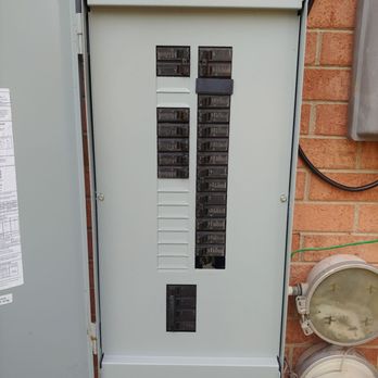 Timothy Lewis Construction - an electrical panel with multiple electrical wires - General Contractors Near Me