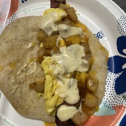 Bacon egg potato cheese and queso Bacon egg potato cheese and queso
