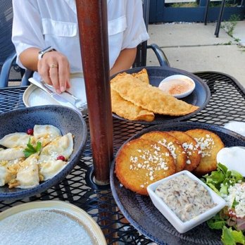 Tryzub Ukrainian Kitchen - Crispy Potato Pancakes w sour cream, Pierogi, pork empanada - Ukrainian Near Me - Chicago, Illinois