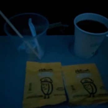 Delta Air Lines - Coffee and two bags of almonds. Yeah it was pretty dark inside - Airlines Near Me - Los Angeles, California