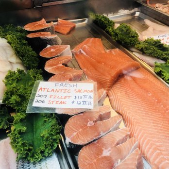 Eastern Market - Seafood vendor selling fresh Atlantic Salmon - Public Markets Near Me - Washington, DC, District of Columbia Eastern Market - Seafood vendor selling fresh Atlantic Salmon - Public Markets Near Me - Washington, DC, District of Columbia