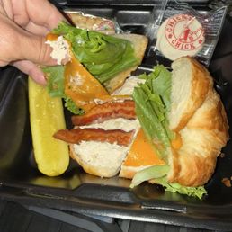 Chicken salad sandwich with tiny bacon slices and little chicken salad . Chicken salad sandwich with tiny bacon slices and little chicken salad .