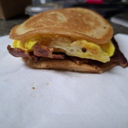 Mac Grilled with bacon. Maple syrup on the side, with no powdered sugar. Mac Grilled with bacon. Maple syrup on the side, with no powdered sugar.