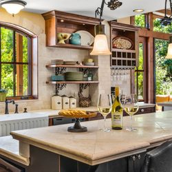 Outfitted for a professional chef with two dishwashers, farm sink, and professional range.