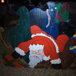 Goodwill Industries of the Columbia Willamette - Hand painted wooden Santa.