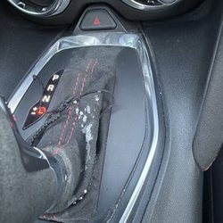 Caliber Collision - Over spray on shift boot.