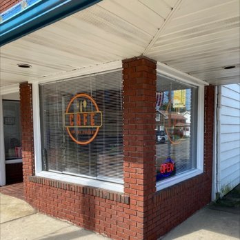 Cafe On The Corner - a sign in a window - Diners Near Me - Malvern, Ohio