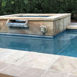 Spa, pool, and waterline tile before remodel. Note calcium stained waterline tile and blotchy faded pool plaster. Spa, pool, and waterline tile before remodel. Note calcium stained waterline tile and blotchy faded pool plaster.