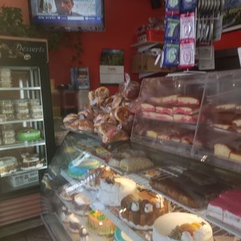 Caramelo Bakery - TV area between the cakes and display shelf - Bakeries Near Me - Wheaton, Maryland