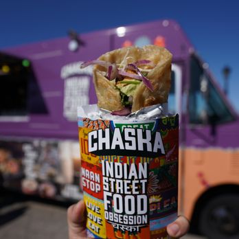 Street Eats Market - a hand holding a wrapper - Food Trucks Near Me - Toronto, Ontario Street Eats Market - a hand holding a wrapper - Food Trucks Near Me - Toronto, Ontario