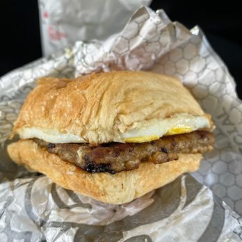 Wendy's - a sausage and egg sandwich on a croissant roll - Burgers Near Me - Rockville, Maryland