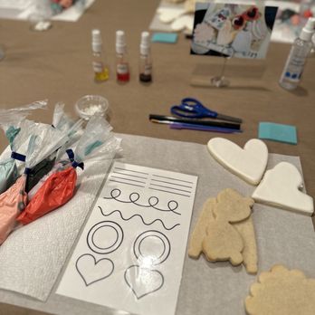 The Cookie Curator - a cookie cutter, cookie cutters, and other crafting supplies on a table - Desserts Near Me The Cookie Curator - a cookie cutter, cookie cutters, and other crafting supplies on a table - Desserts Near Me