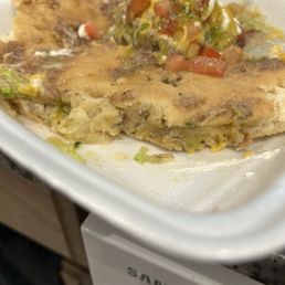 This is not fry bread I ended up scraping the toppings off and threw it away. This is not fry bread I ended up scraping the toppings off and threw it away.