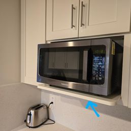 Custom built microwave shelf.