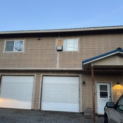 Cruz Construction Services - This is before, never painted in 34 years house with siding and primer.