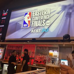 a man holding a glass of beer a man holding a glass of beer