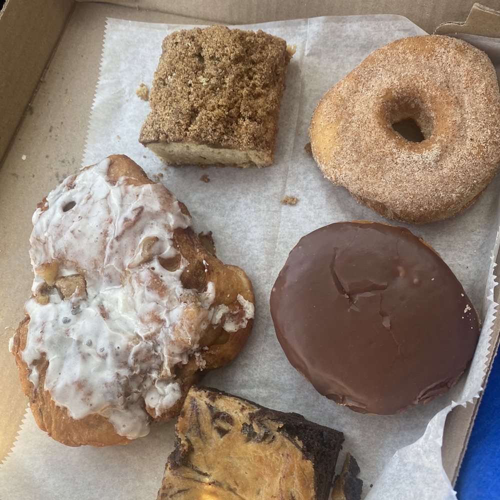 Apple fritter, Boston cream, cheesecake brownie, cinnamon sugar donut, coffee cake, all VEGAN!