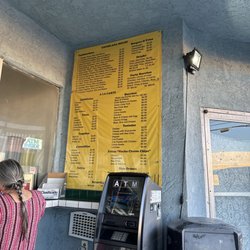 Menu on wall - ATM visible meaning "cash only" :-)