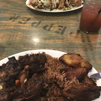 Mad Cow Grill - Oxtails with rice, beans, and great tasting plantains. Dish on top is the fish tacos. Sorry did not get a good pic of them. - American Near Me - Laurel, Maryland