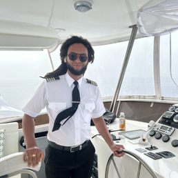 Captain Durant manning the boat Captain Durant manning the boat