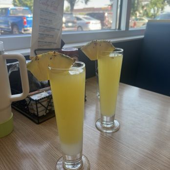 Broken Yolk Cafe - Coconut pineapple mimosa - Breakfast & Brunch Near Me - Meridian, Idaho