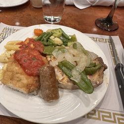 Tozzi's On 12th - Veal, Italian sausage, grilled pork chop and penne pasta.