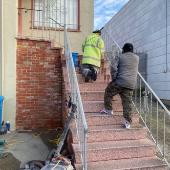 Rainbow Terrazzo - two men climbing up a set of stairs - General Contractors Near Me - San Francisco, California Rainbow Terrazzo - two men climbing up a set of stairs - General Contractors Near Me - San Francisco, California