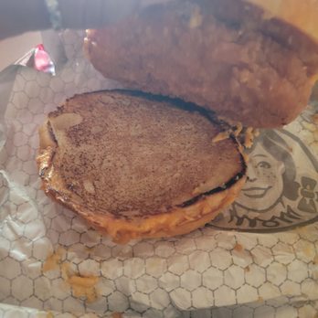 Wendy's - a half eaten sandwich on a wrapper - Fast Food Near Me - Troy, Ohio