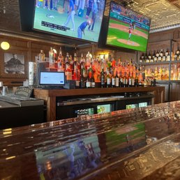 a bar with a large television