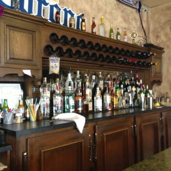 Mi Casita - a bar with a lot of bottles on it - Salvadoran Near Me - Windsor, Ontario