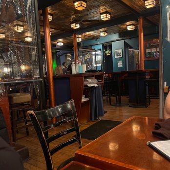 The Hill Tavern - a man sitting at a table - Pubs Near Me - Boston, Massachusetts The Hill Tavern - a man sitting at a table - Pubs Near Me - Boston, Massachusetts