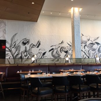 Earls Kitchen + Bar - Inside lounge area seating with mural - New American Near Me - Orlando, Florida
