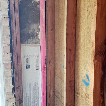J National - this was supposed to be a moisture barrier.  the moldy siding was supposed to be removed and replaced.  they left it in place. - Plumbing Near Me - Carrollton, Texas