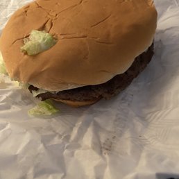 a hamburger with lettuce on it a hamburger with lettuce on it