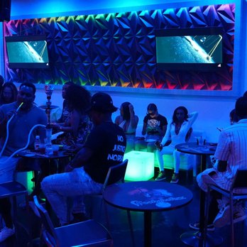 Hookaholixx - a group of people in a bar - Hookah Bars Near Me - Miramar, Florida