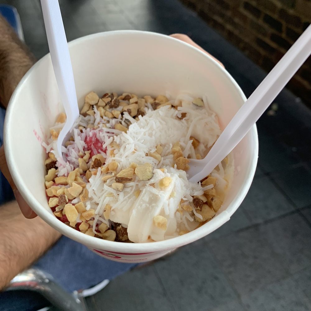 Yumilicious - Tart, Strawberry Tart and Raspberry Pomegranate flavors with coconut flakes, peanuts and almonds - Ice Cream & Frozen Yogurt Near Me - Dallas, Texas Yumilicious - Tart, Strawberry Tart and Raspberry Pomegranate flavors with coconut flakes, peanuts and almonds - Ice Cream & Frozen Yogurt Near Me - Dallas, Texas