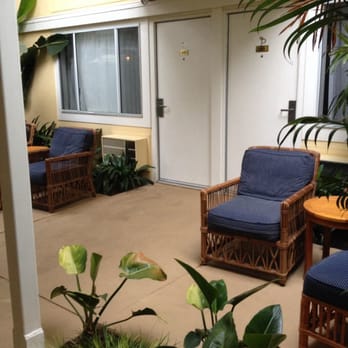Pavilion Hotel - The "semi-private patio". Two chairs each and we moved an ottoman outside. Other rooms had a divider, but we had 213 & 215. - Hotels Near Me - Avalon, California