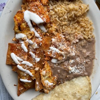El Guapito - Red chilaquiles mixed with eggs, fried beans, quesadilla and red rice - Mexican Near Me - Bell, California El Guapito - Red chilaquiles mixed with eggs, fried beans, quesadilla and red rice - Mexican Near Me - Bell, California