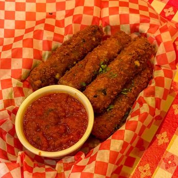 Gino's East - Magnificent Mile - Legendary Handrolled Spinach Mozzarella Sticks - Pizza Near Me - Chicago, Illinois Gino's East - Magnificent Mile - Legendary Handrolled Spinach Mozzarella Sticks - Pizza Near Me - Chicago, Illinois