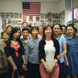 Kang's Language Service - Ms Kang standing together with her clients.