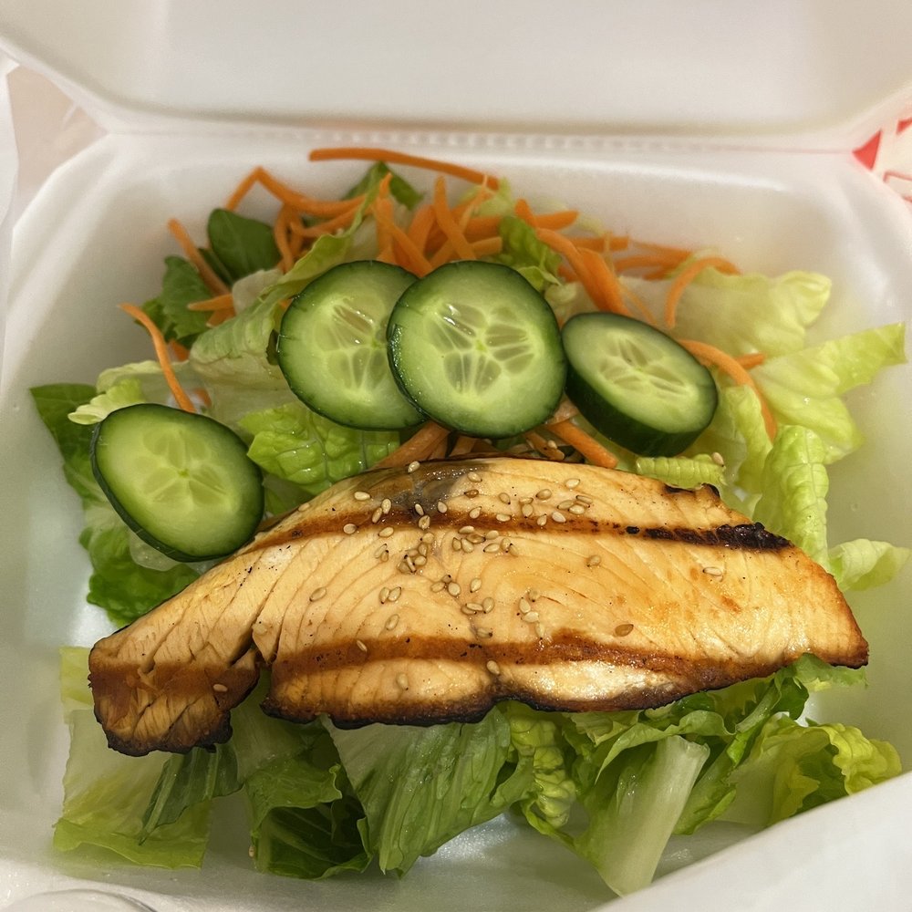Grilled salmon salad. Over cooked and not much of a meal. Grilled salmon salad. Over cooked and not much of a meal.